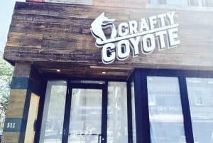 Crafity Coyote bar entrance with modern design and signage in Toronto nightlife scene.
