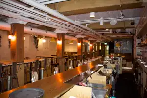 Stylish Toronto club bar interior with modern decor and ambient lighting.